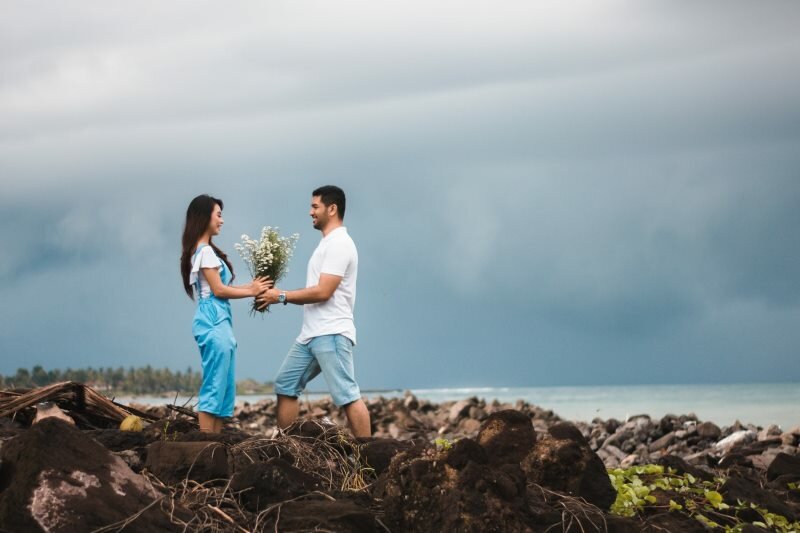 Man Interest Chasing Giving Flowers To Woman