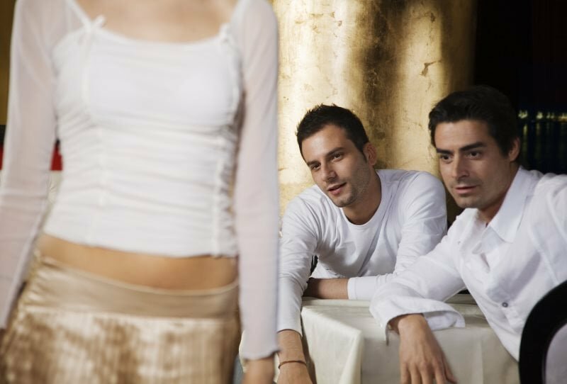 It may be obvious why these two guys are staring, but then why are they not approaching her? Guys Staring At Woman