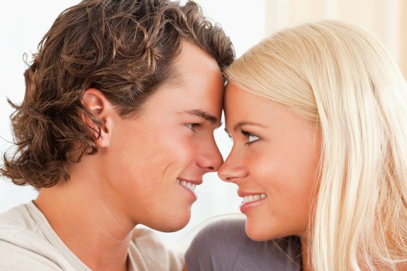 Couple Enjoying Present Smiling Close